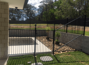 Custom black flat top pool panel fence